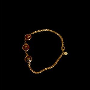 Nina Ricci golden and red chain bracelet